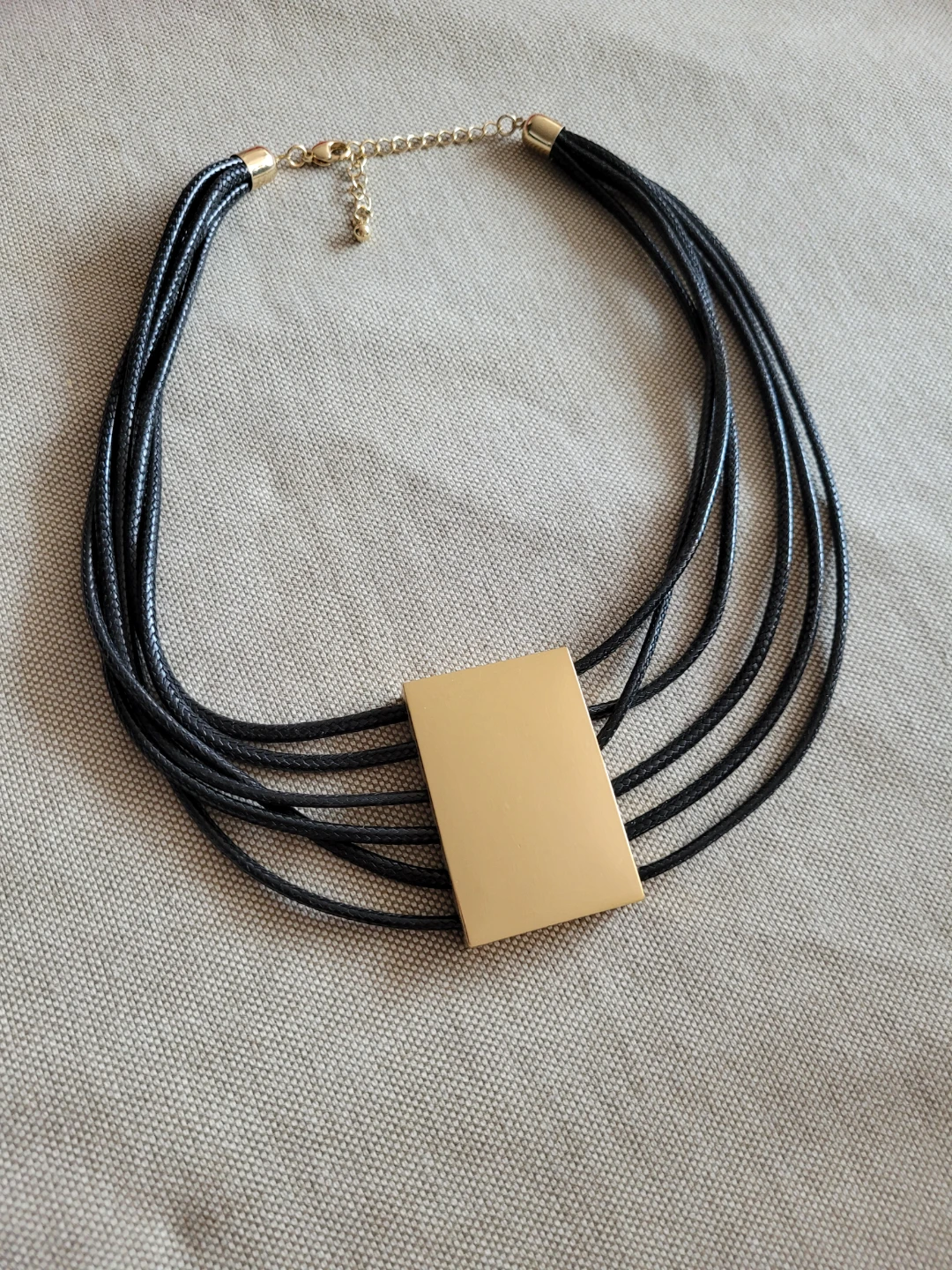 Black Multi-Strand Necklace with Gold-Tone Pendant