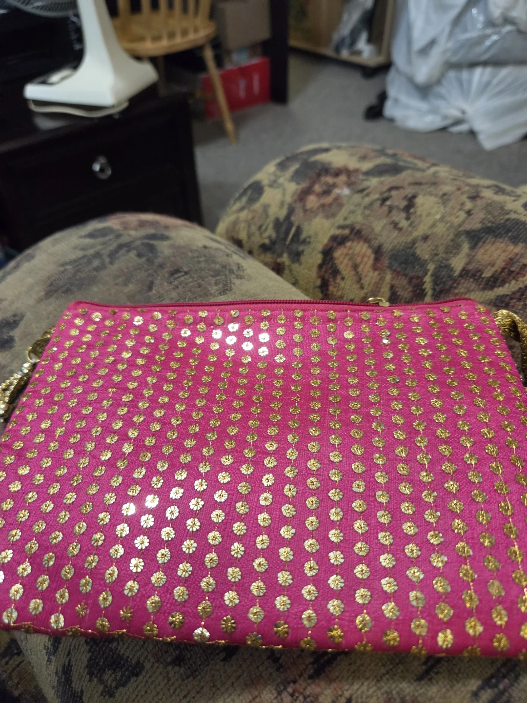 Pink sequined clutch bag