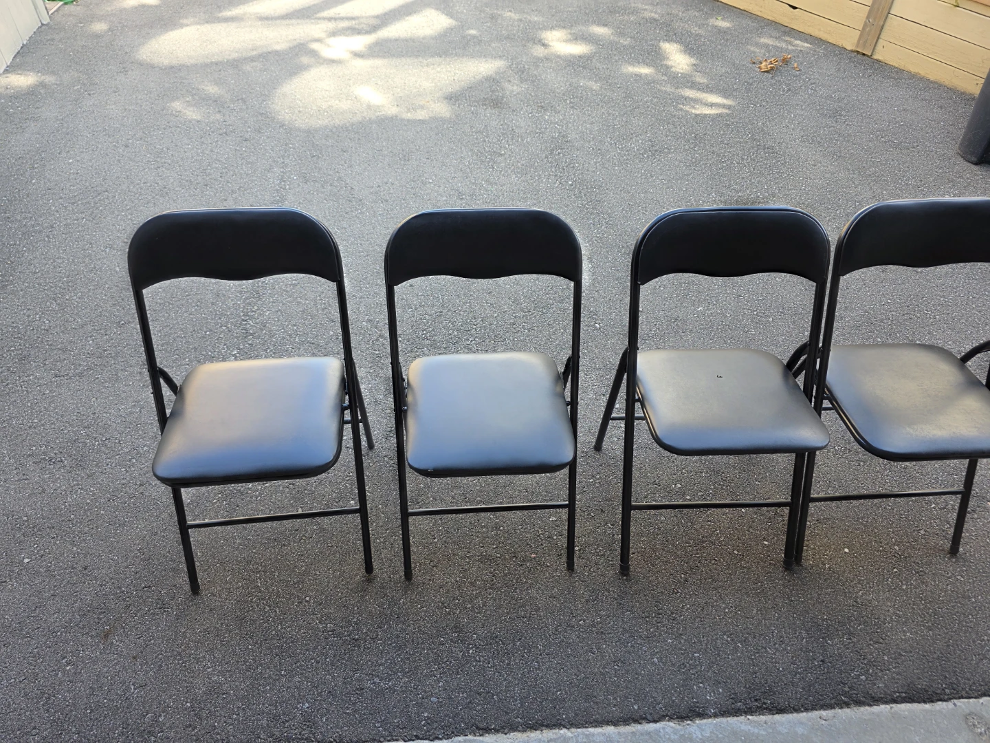 4 Black Folding Chairs [One Free]