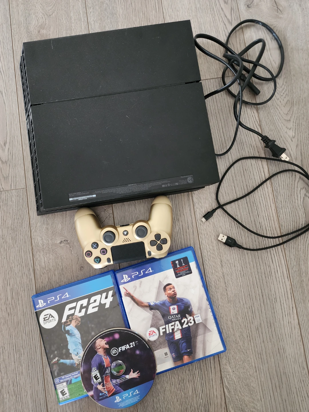 PlayStation 4 Console with FIFA 23, FIFA 21, and FC 24 Games