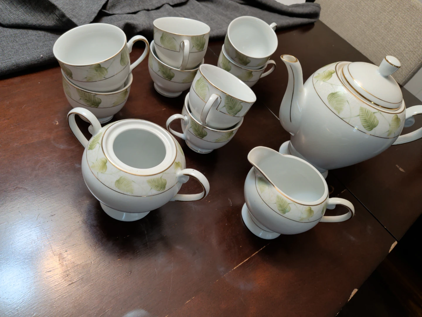 White Teapot and Cup Set with Green Leaf Design