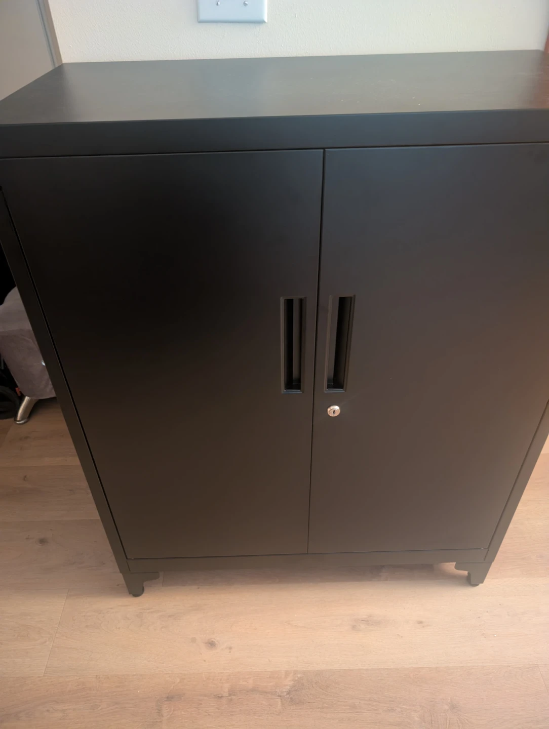 Black metal storage cabinet