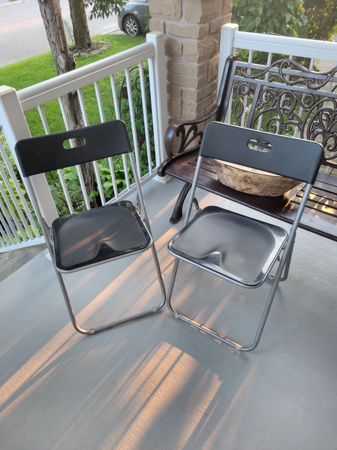 Two black folding chairs