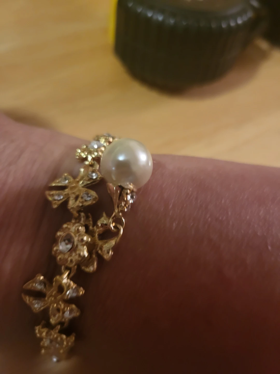 Gold-tone bracelet with faux pearls and rhinestones