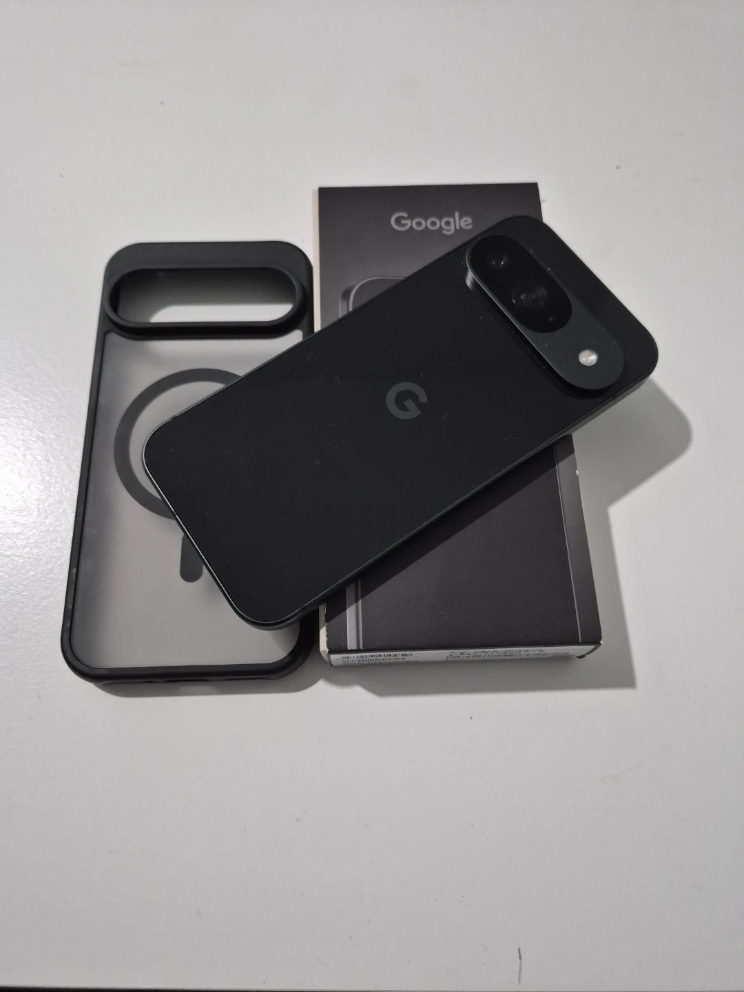 Google Pixel 9 phone with case and box