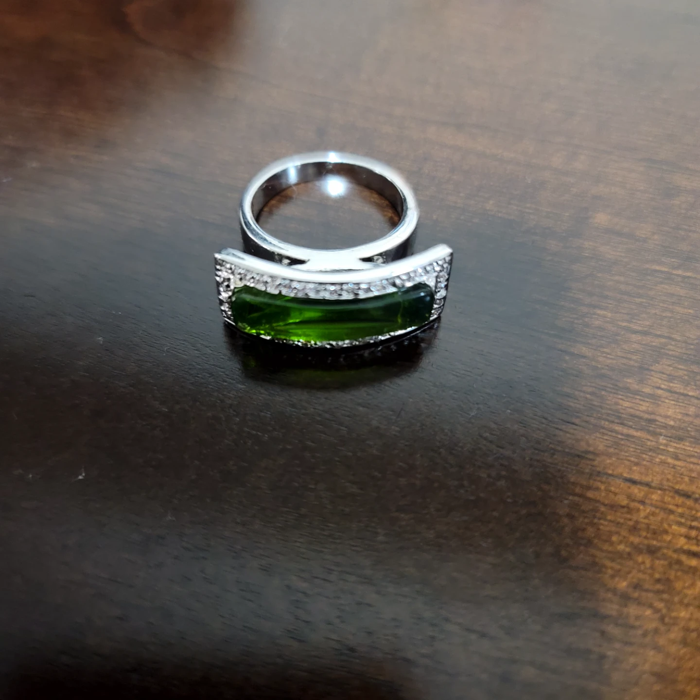 Silver-tone ring with green stone