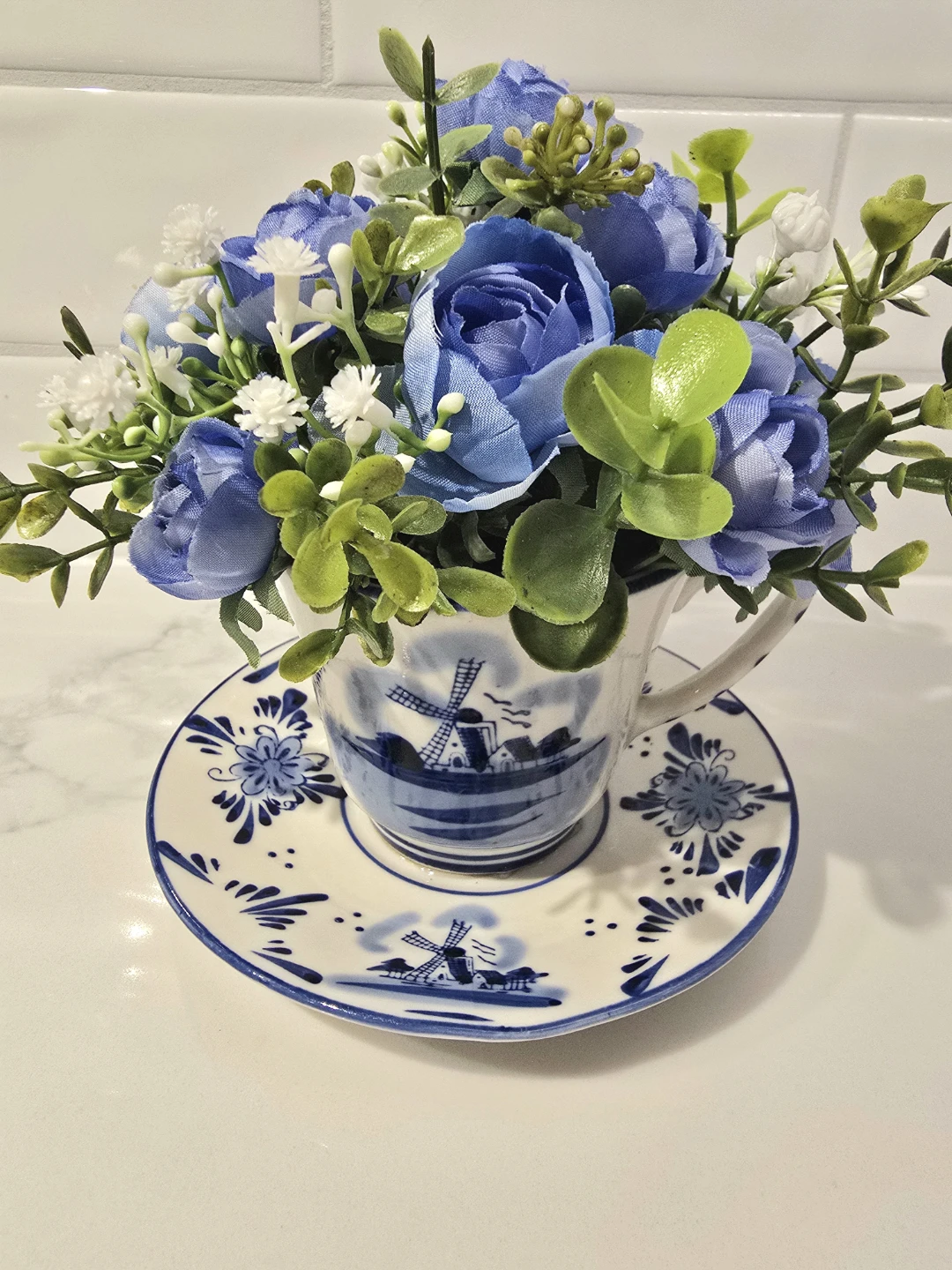 Artificial Flower Arrangement in Teacup and Saucer