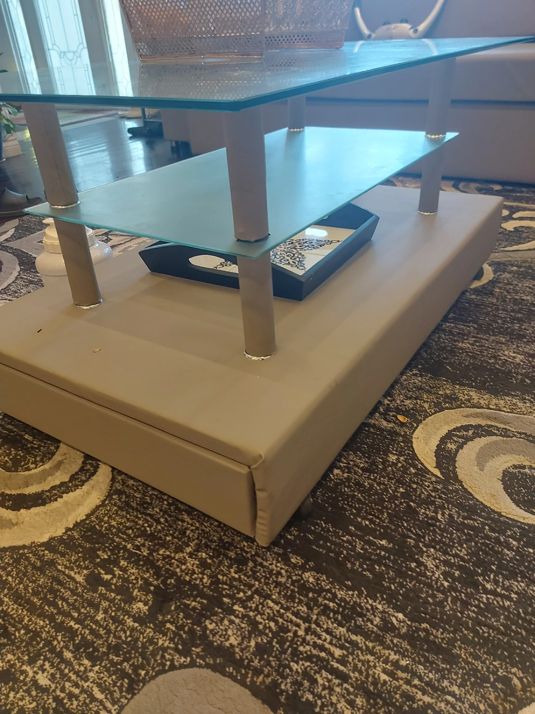 Glass top coffee table with storage