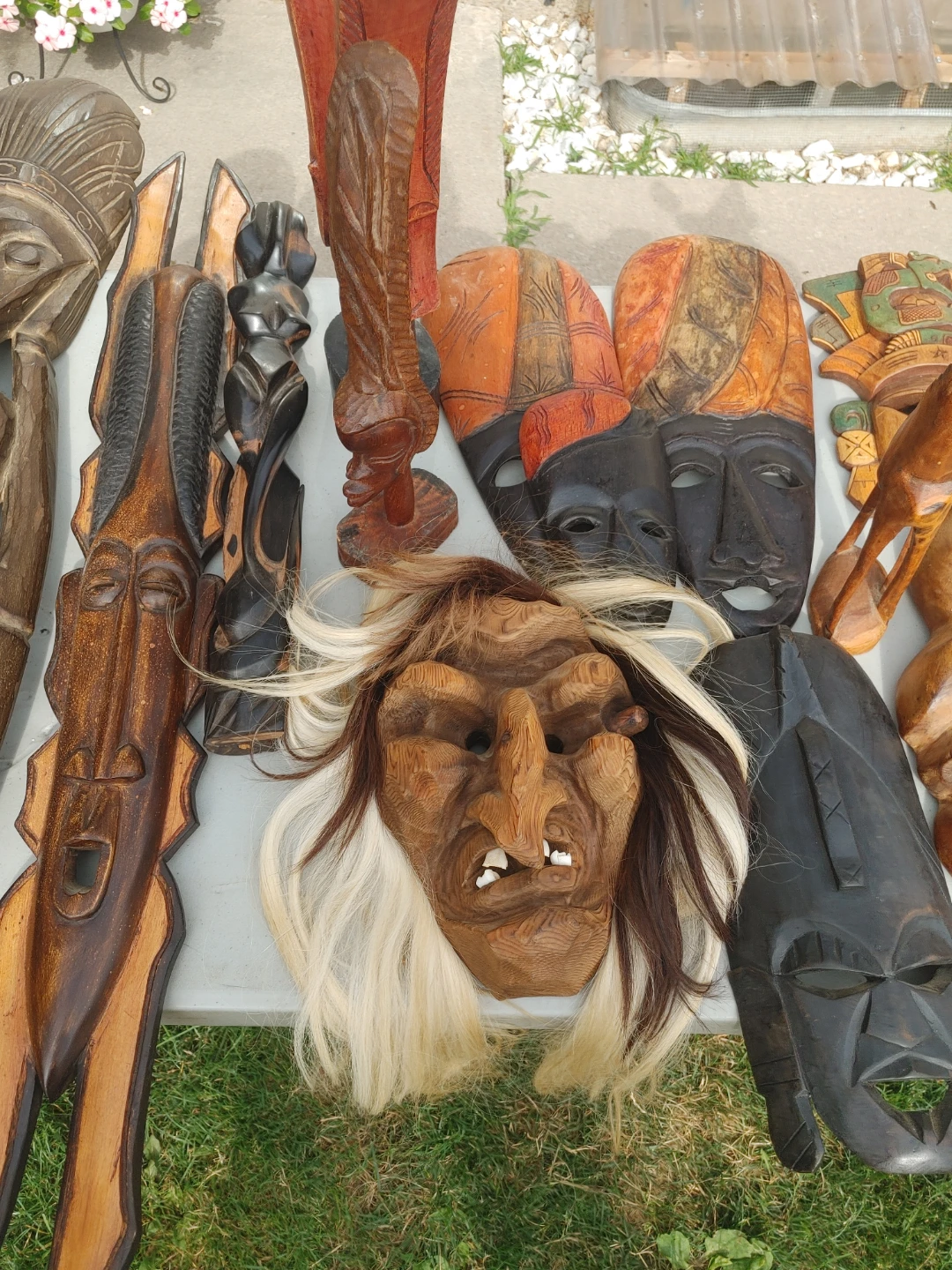 Various Hand-Carved Wooden Masks and Figures