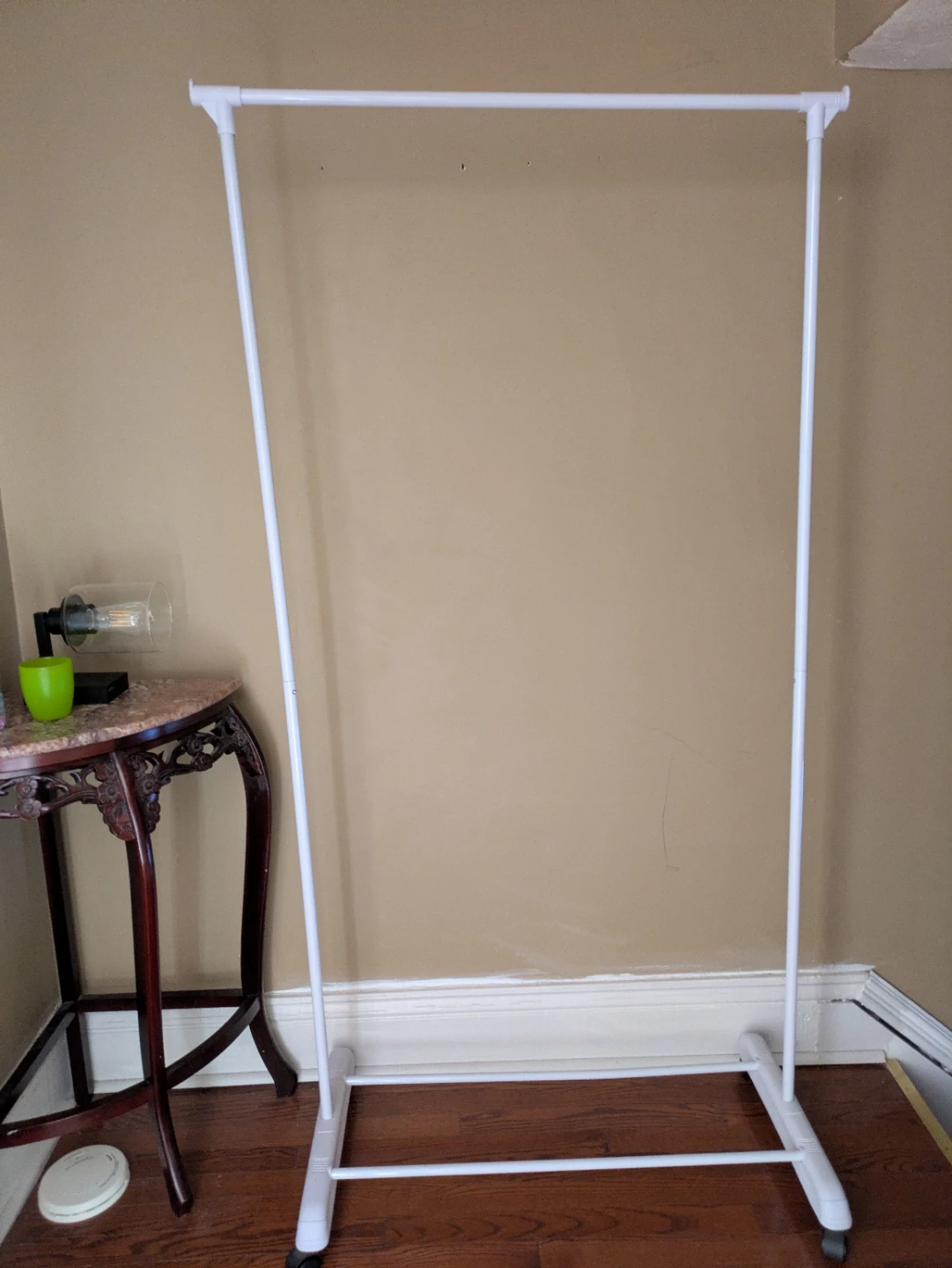 White garment rack with wheels