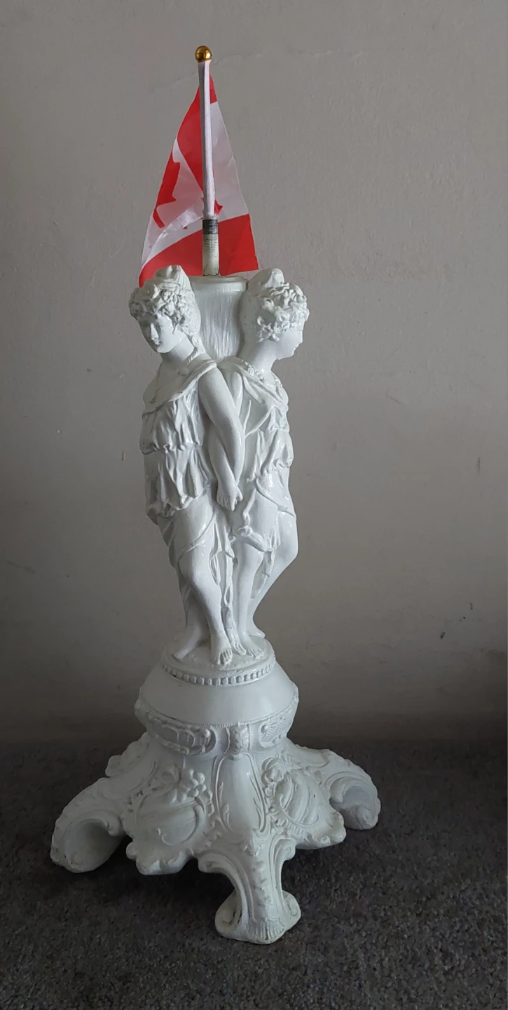 White Decorative Statue with Canadian Flag