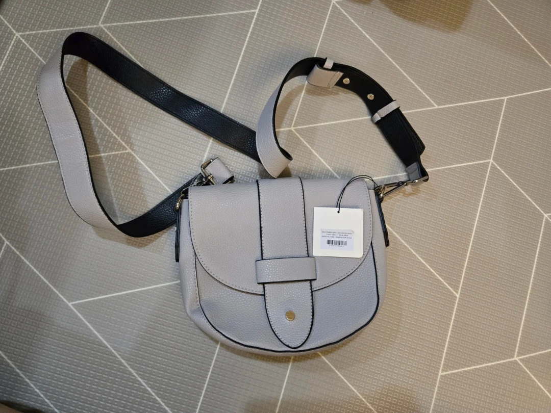 Grey crossbody bag with black strap