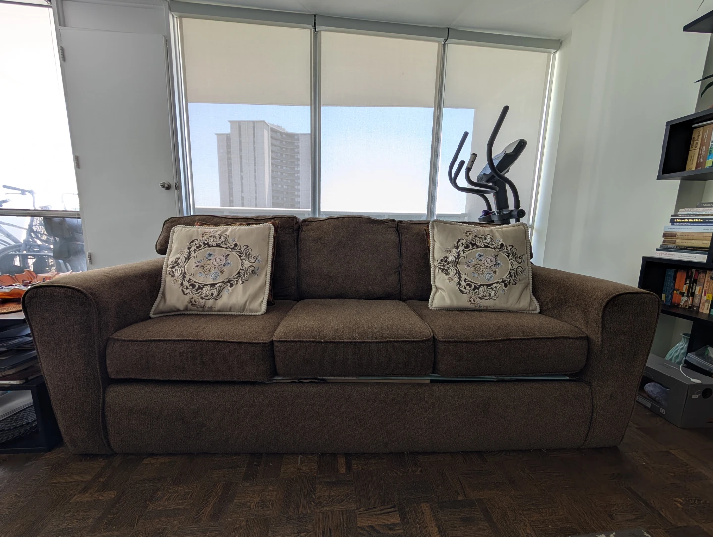 Leon's Brown upholstered couch with decorative pillows