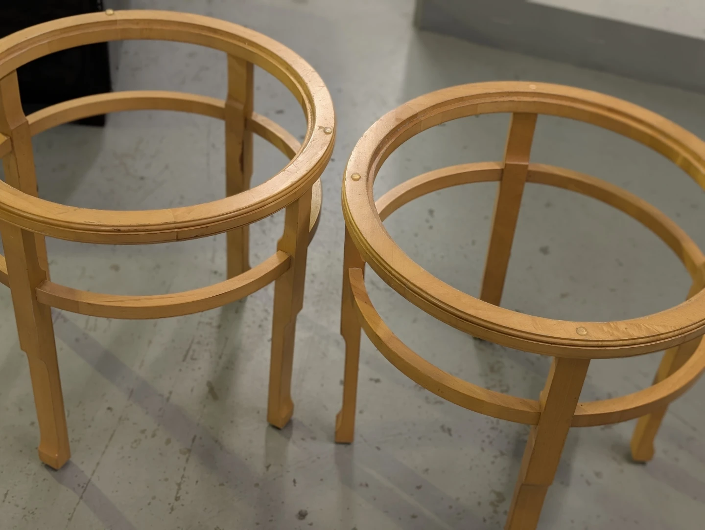 Pair of glass-top wooden base tables