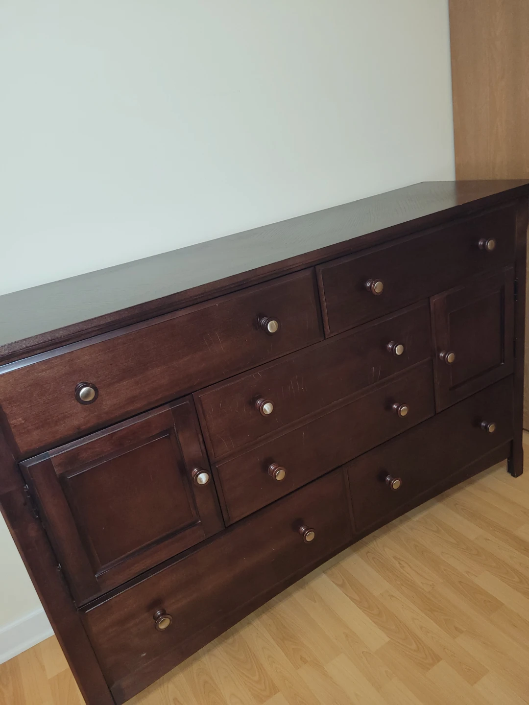 Dark Wood Dresser with Multiple Drawers and Cabinets