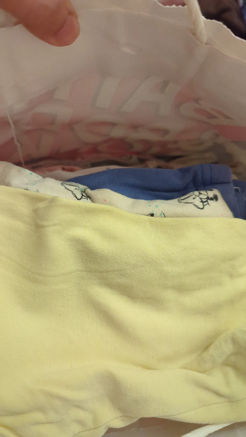 Bag full of clothing for one + baby girl