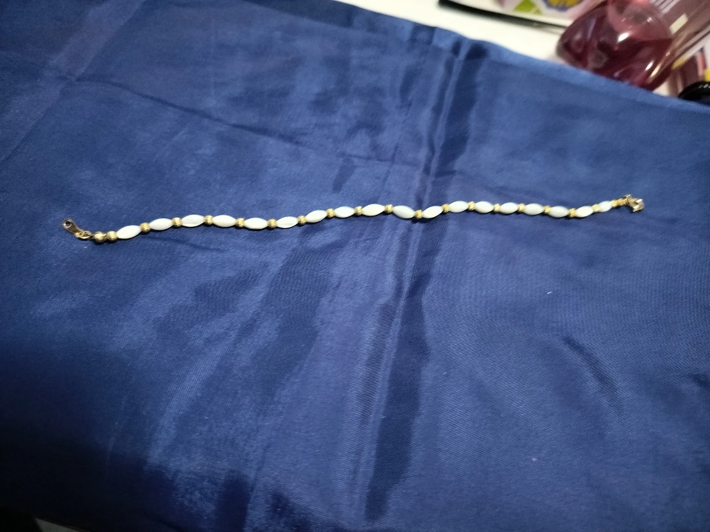 Gold tone anklet with white beads