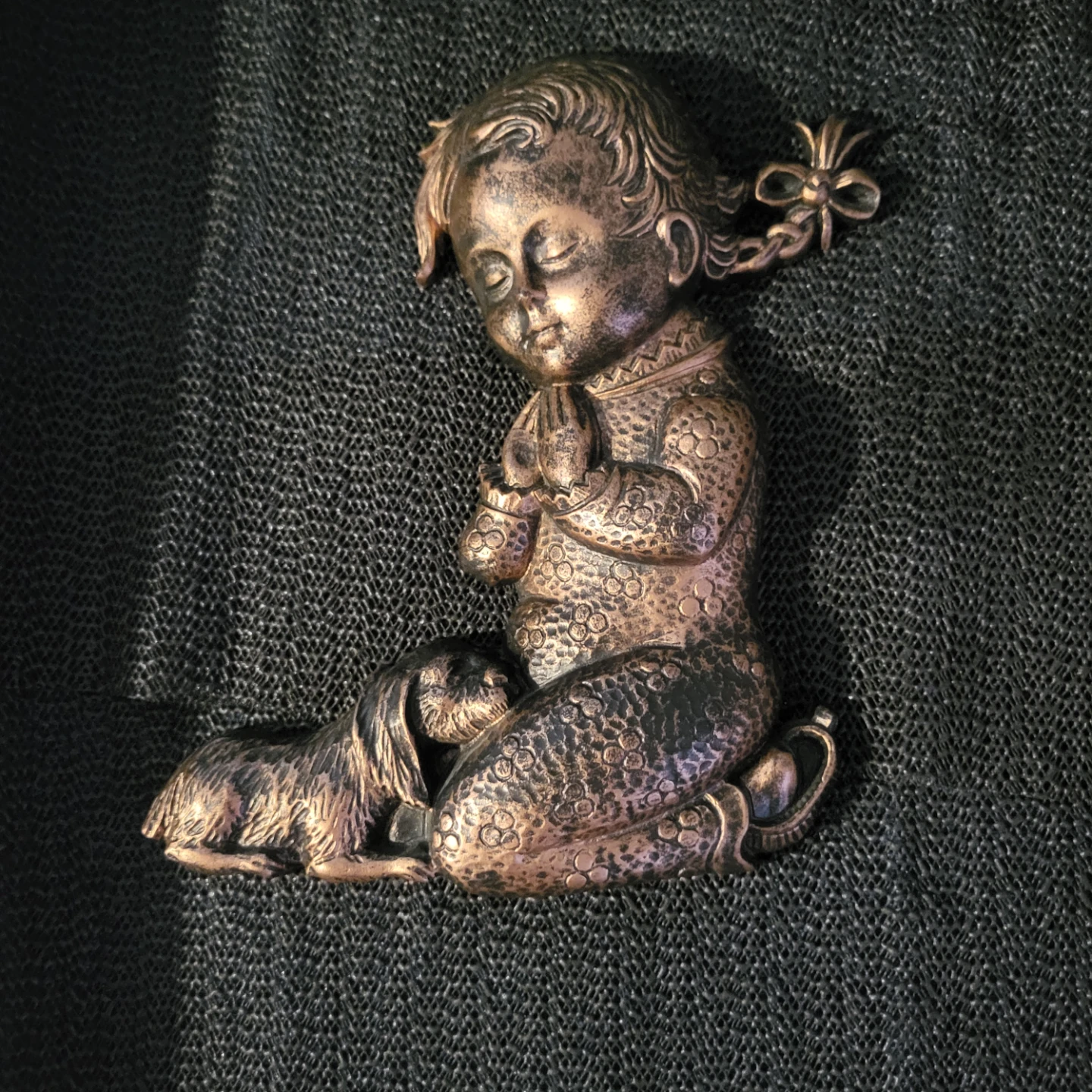 Praying Child with Dog Figurine