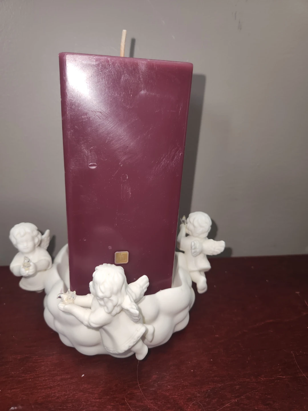 Partylite candle Holder with Cherubs and Burgundy Pillar Candle