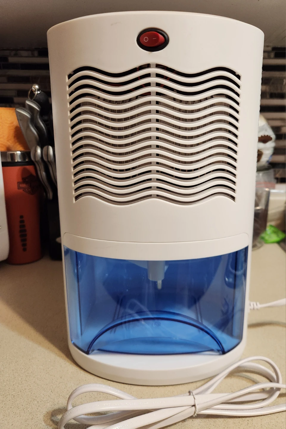 Compact Dehumidifier with holding tank.