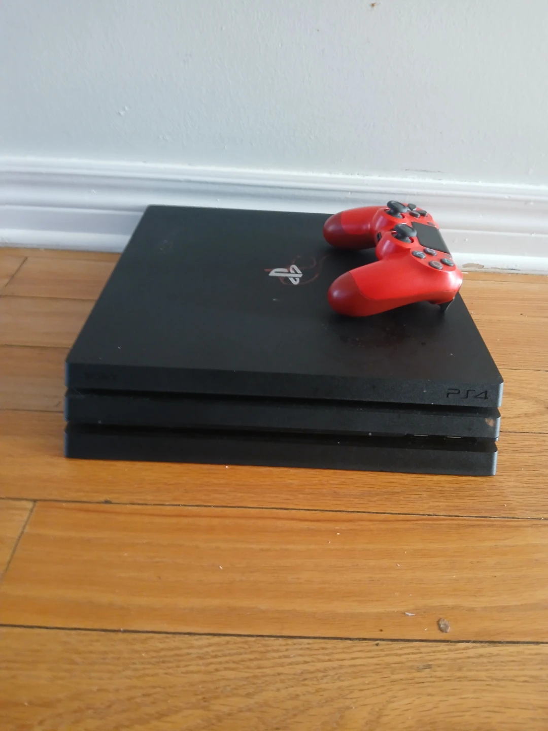 PlayStation 4 Pro Console with Spider-Man Game and controller
