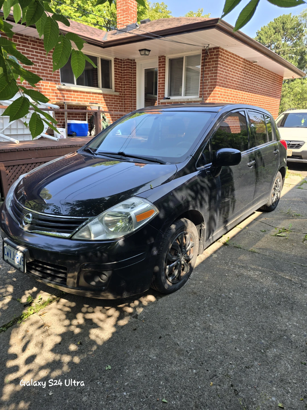 Black Nissan Versa Hatchback