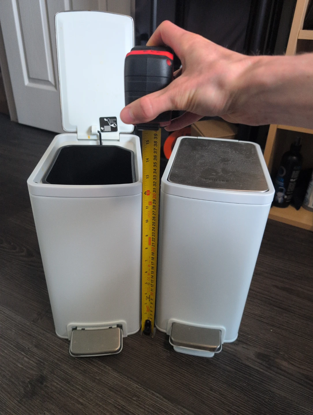 Two small garbage cans