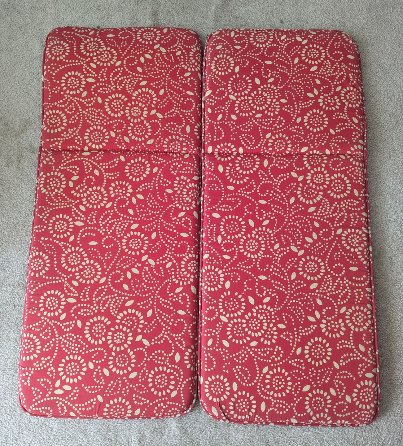 Pair of red floral cushions for bench