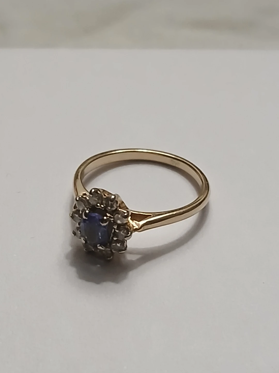 Gold cluster ring with sapphire and diamonds