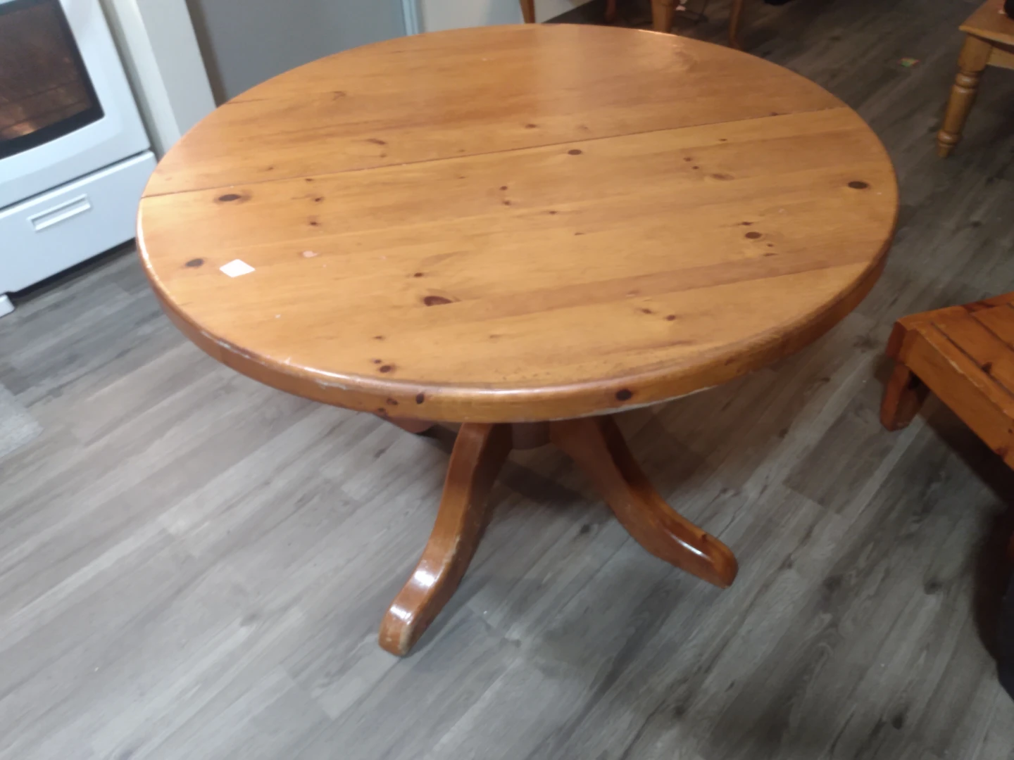 Round Wooden Pedestal Dining Table