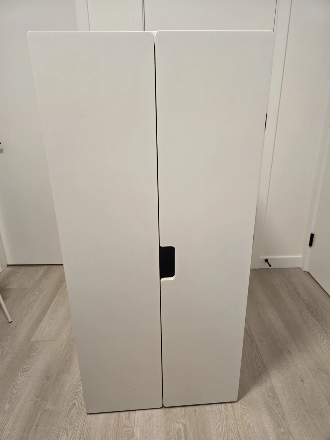 White Storage Cabinet with Hanging Rod and Baskets