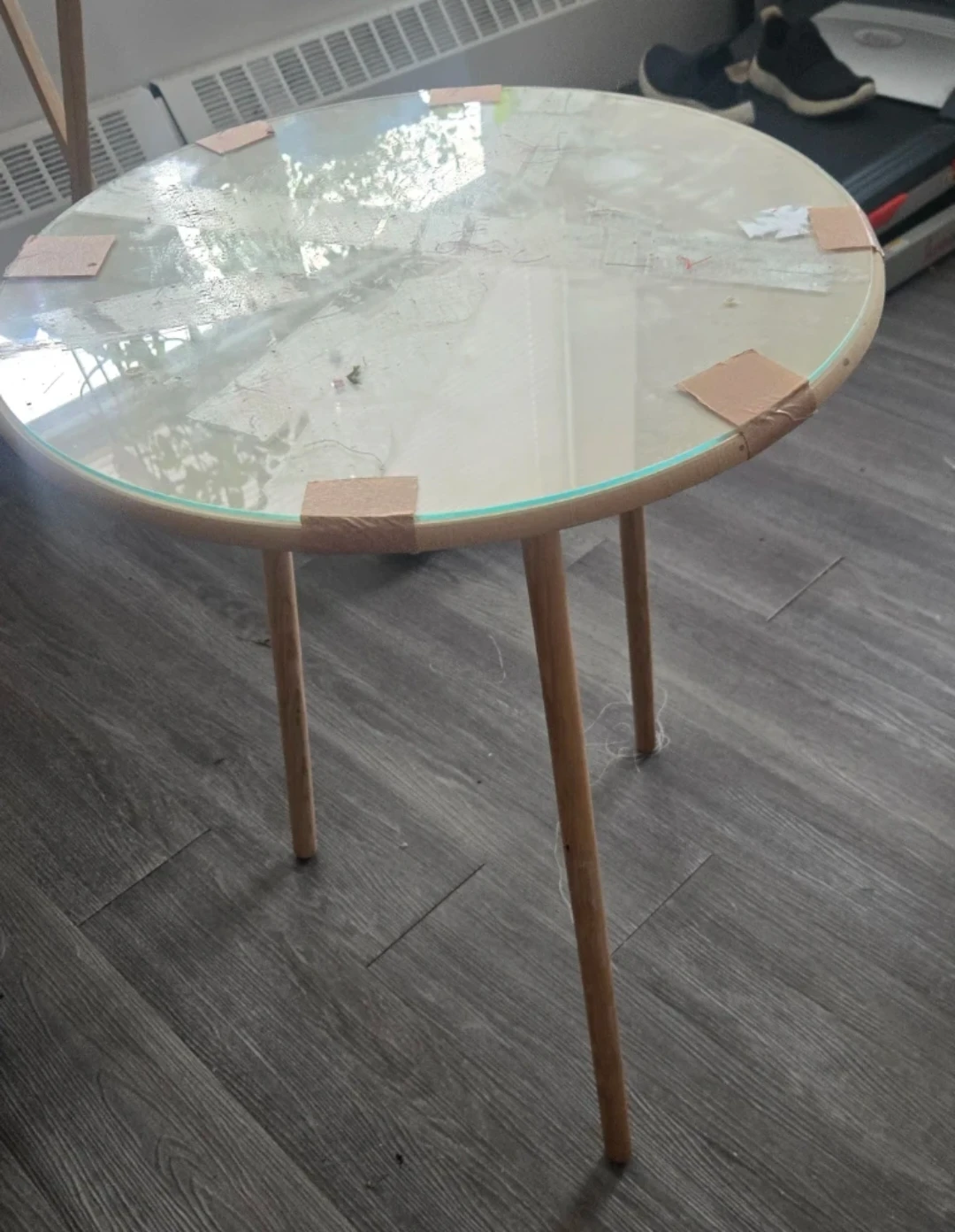 Wooden round side table with glass top