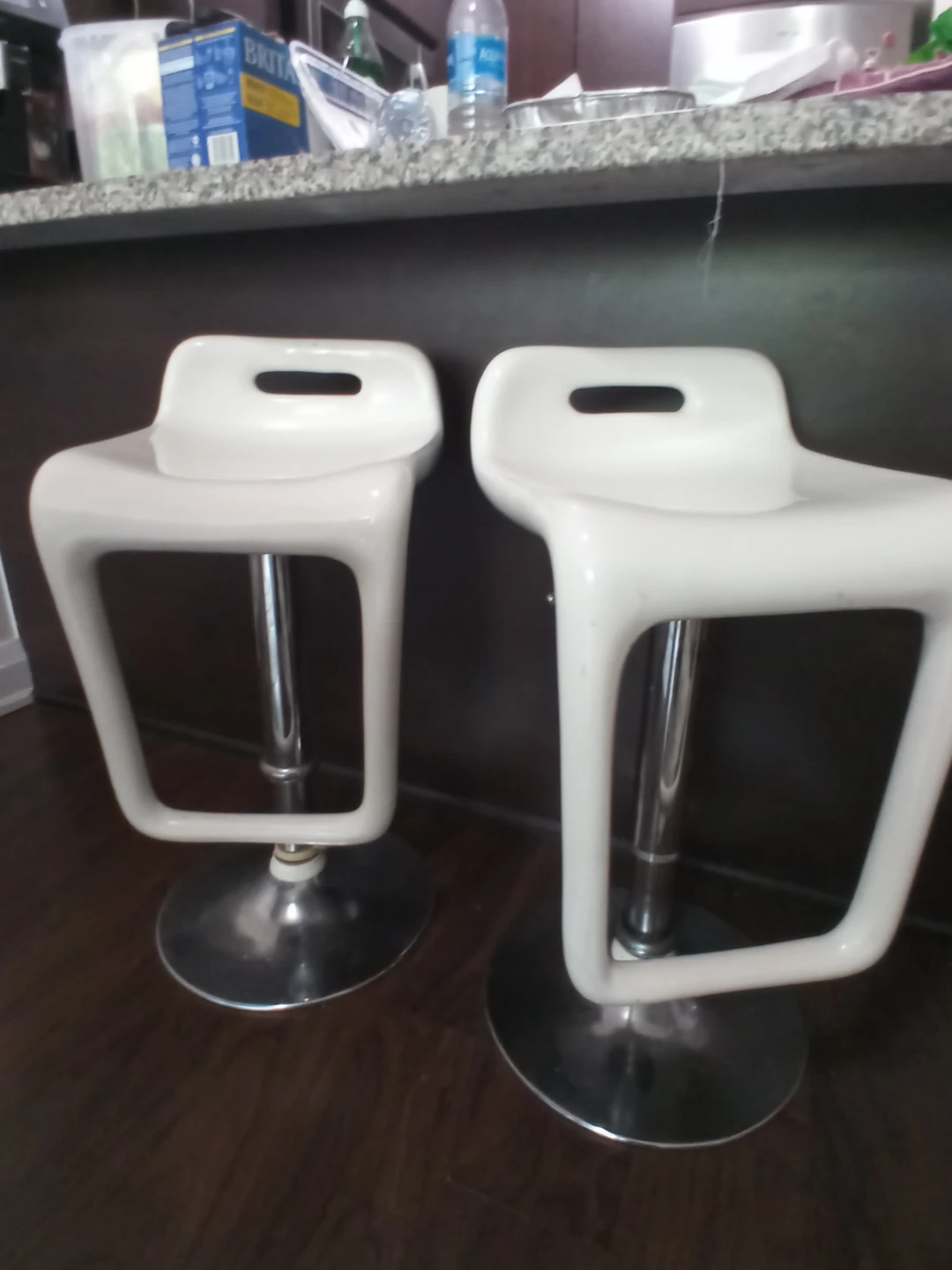 Pair of white adjustable swivel bar stools