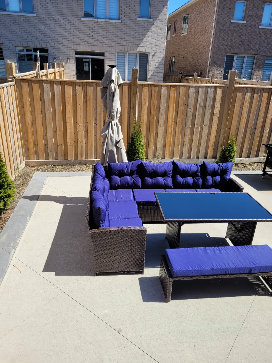 Wicker Patio Set with Blue Cushions and Glass Table