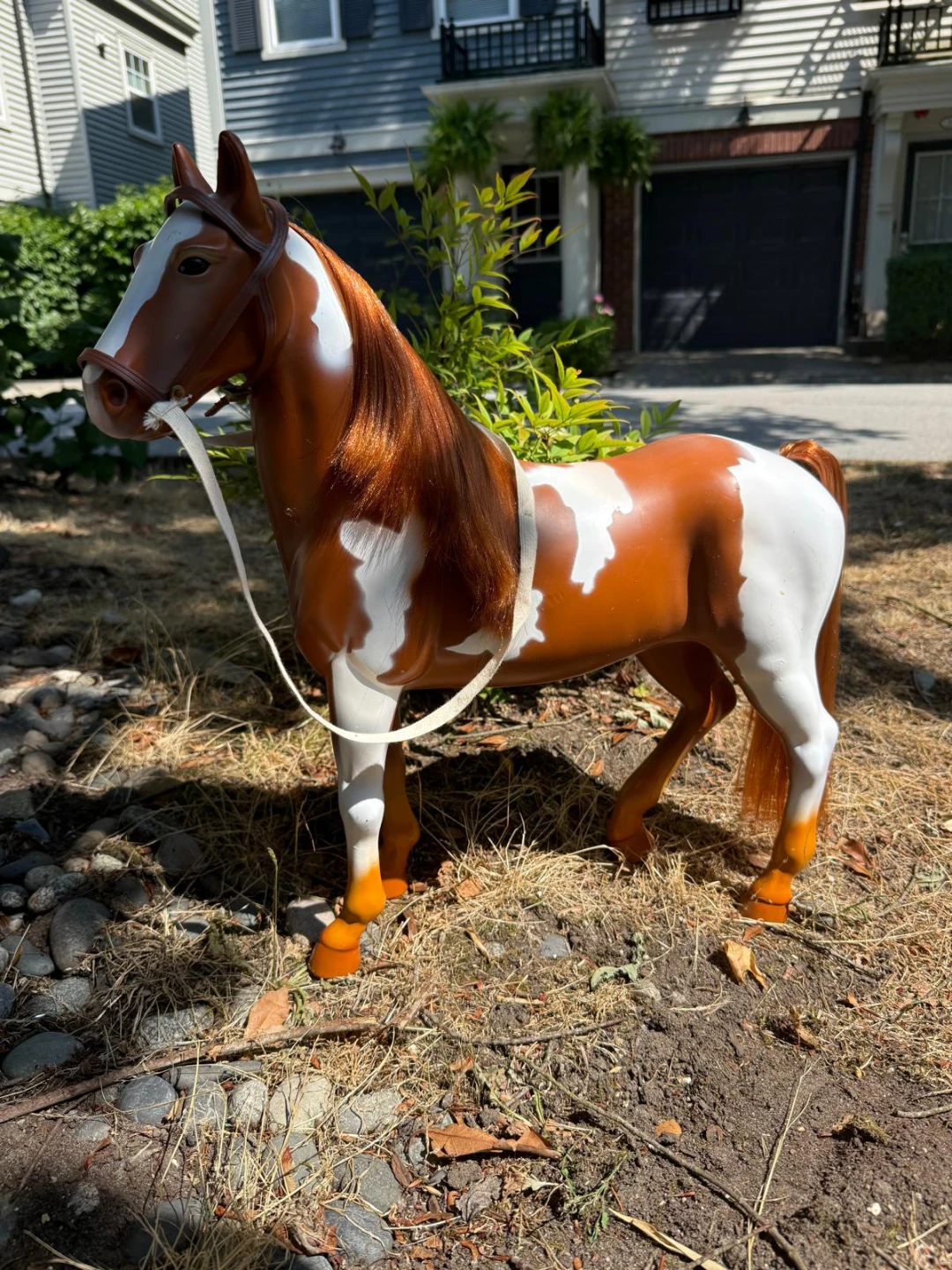 Brown and White Toy Horse with Bridle