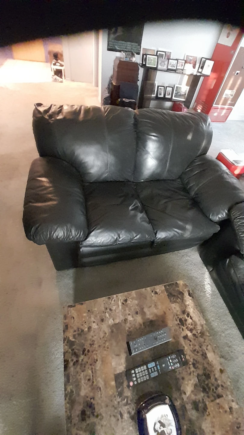 Black leather couch and loveseat combination