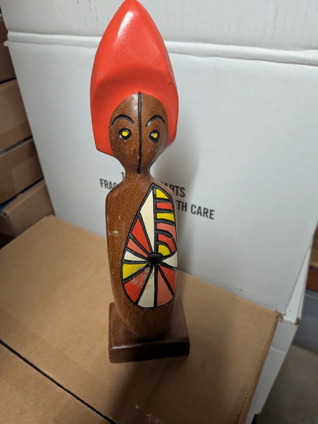 Wooden Figurine with Red Headpiece