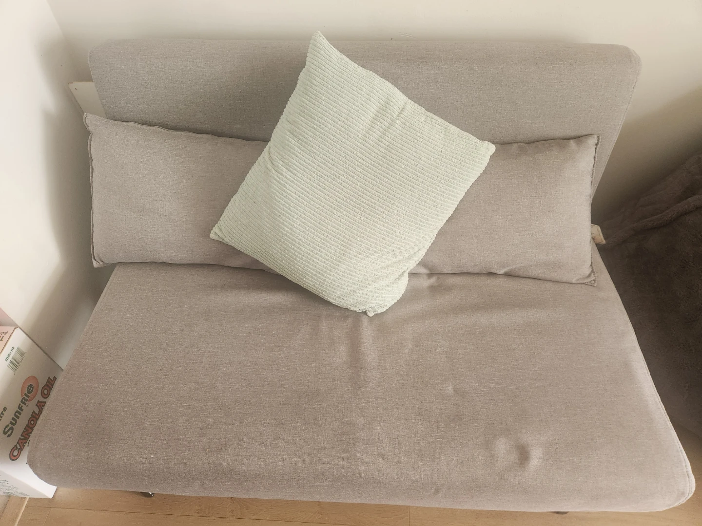 Beige Futon Couch with Pillows