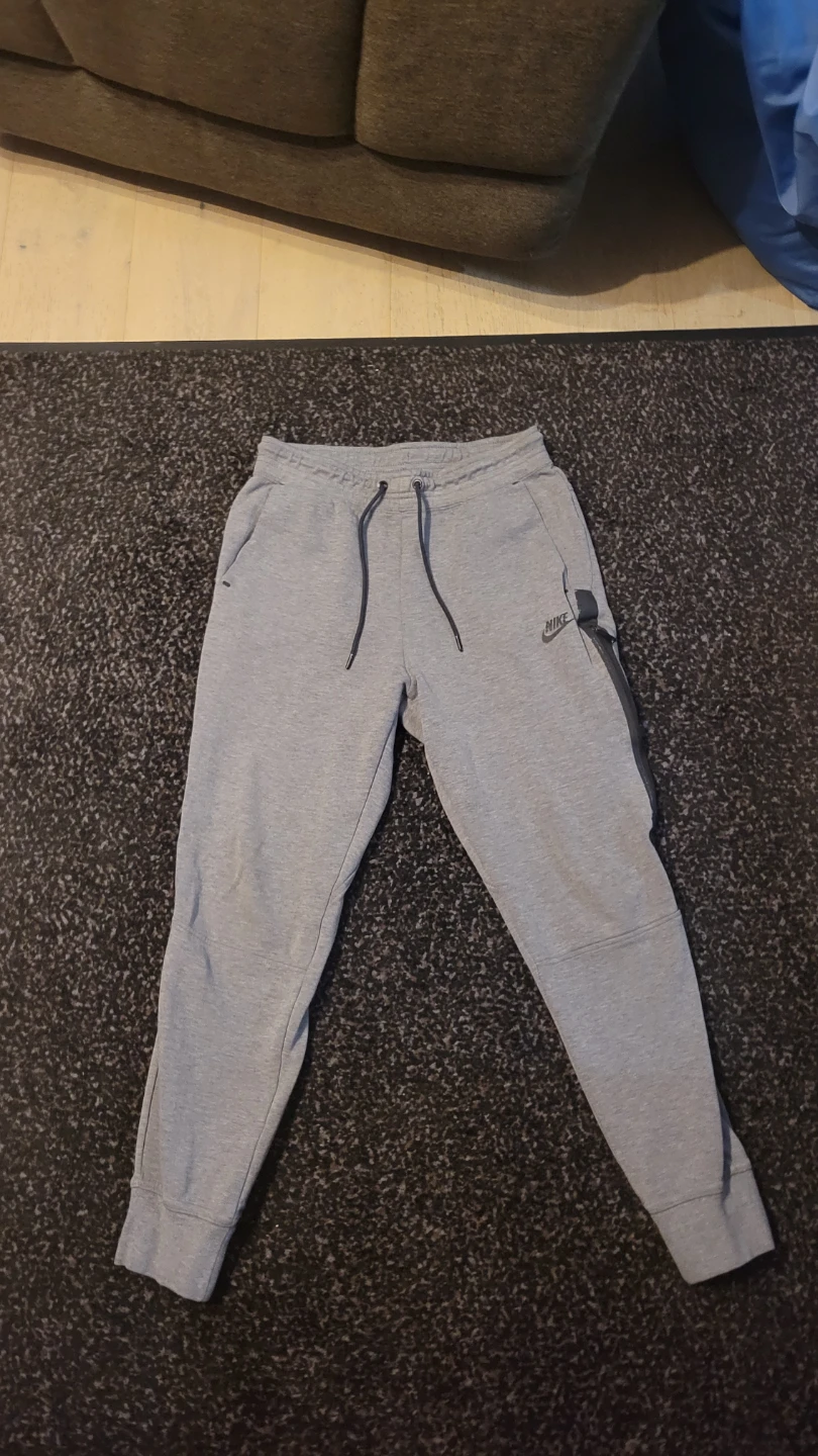 Grey Nike tech pants