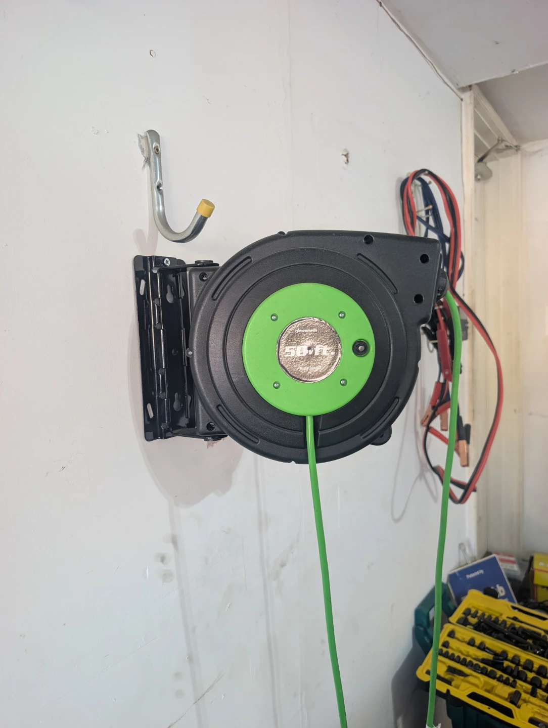 Wall mounted 50ft retractable extension cord