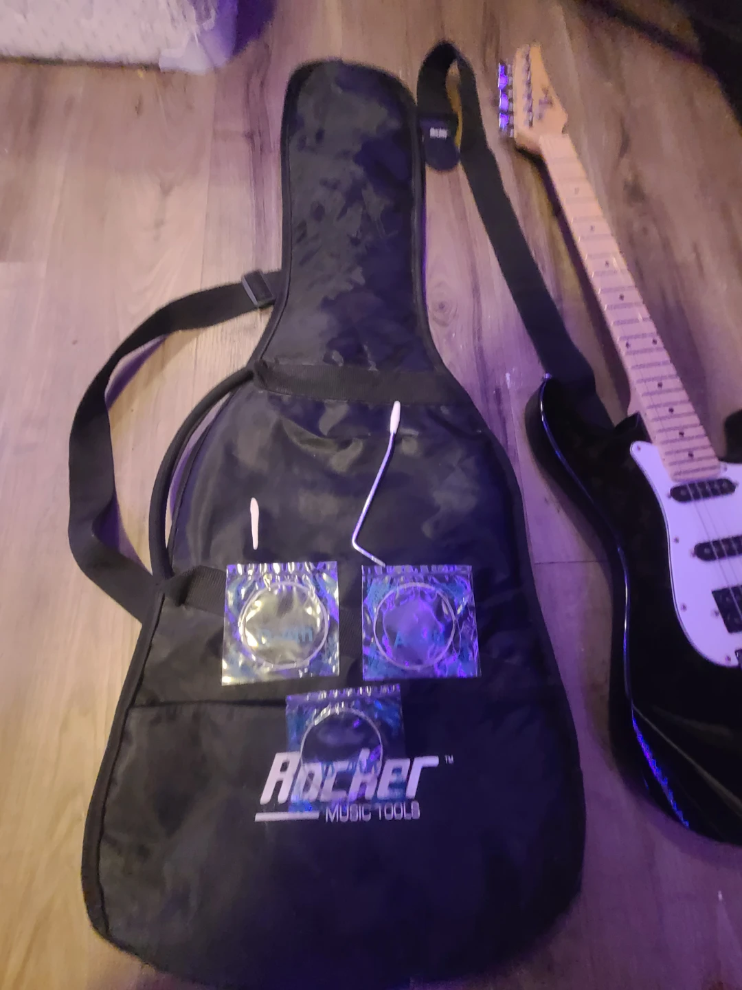 Rocker Electric Guitar with Gig Bag and Extra Strings whammy bar