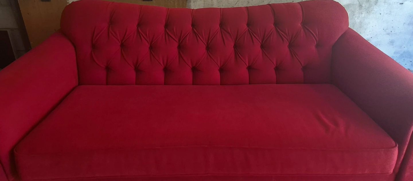 Red Tufted Sofa with Pillows