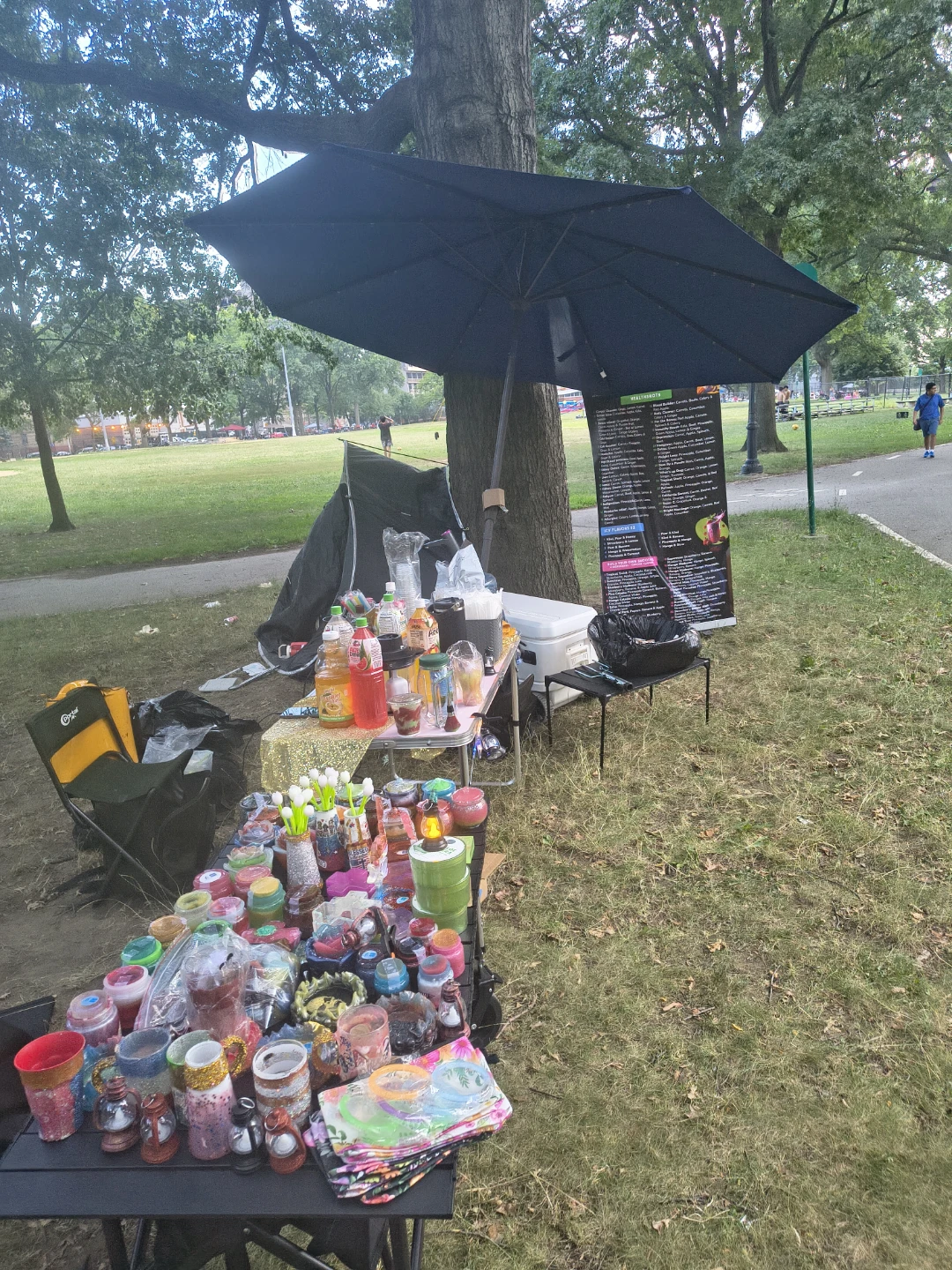 Variety of drinks and cups at outdoor event