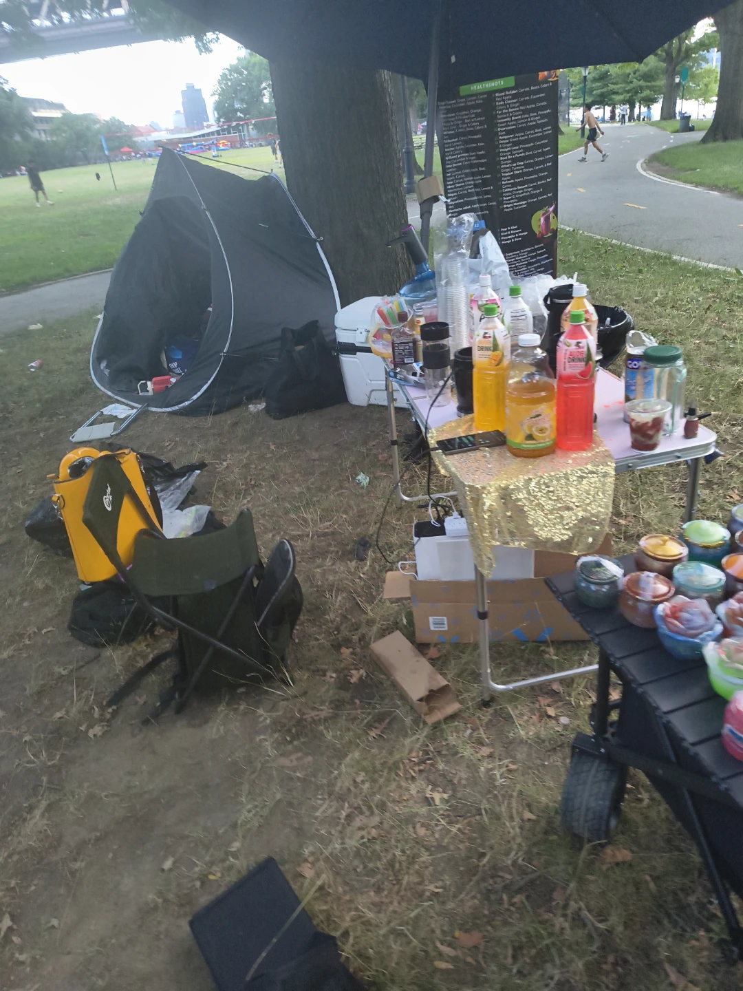 Variety of drinks and cups at outdoor event - photo 3