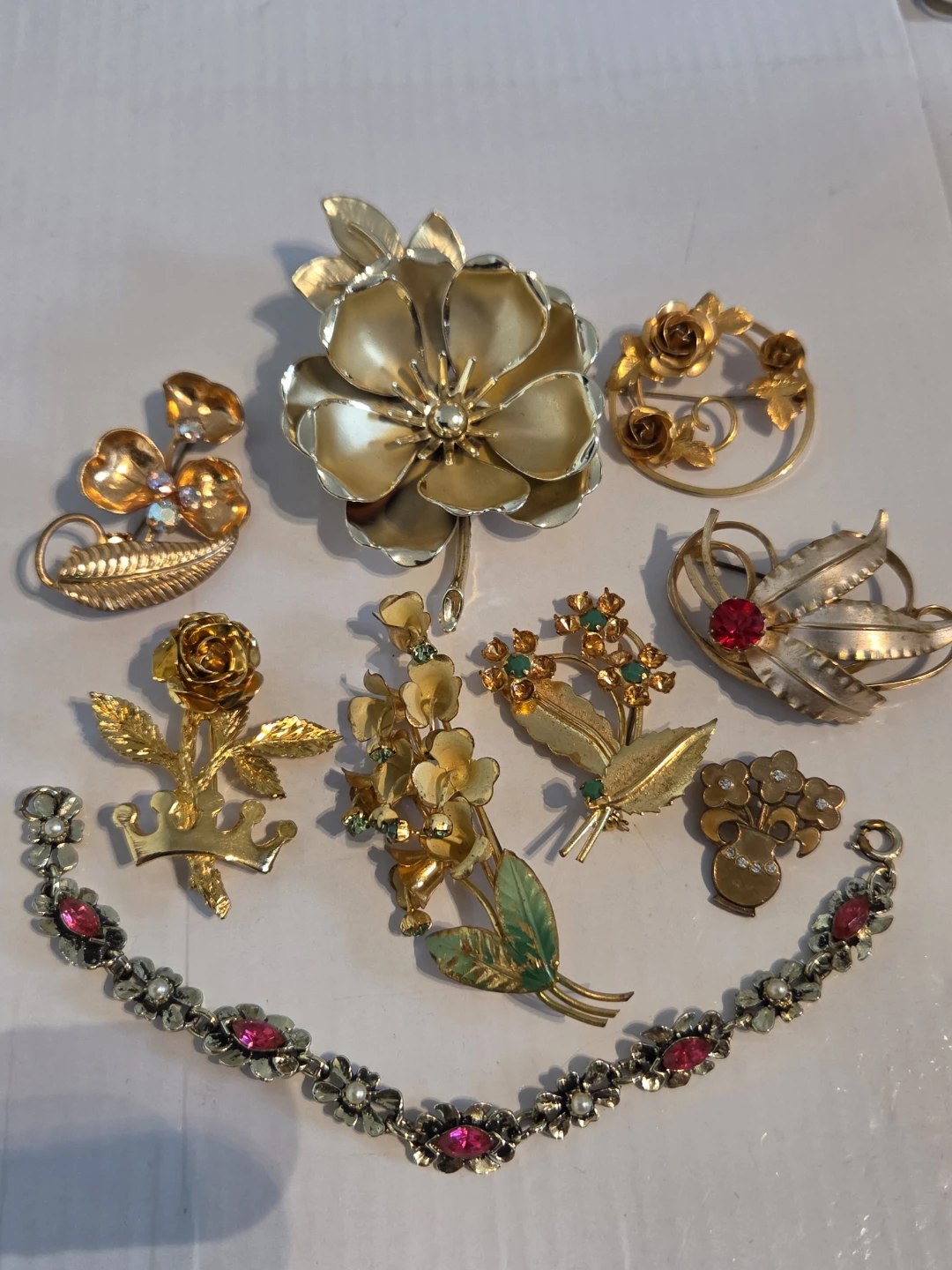 Floral brooches and bracelet
