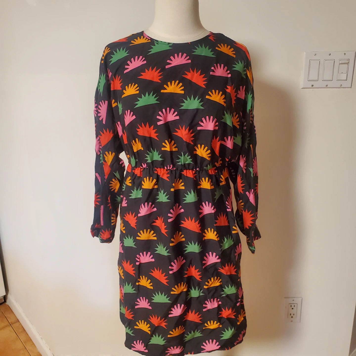 Black dress with colourful sunburst print