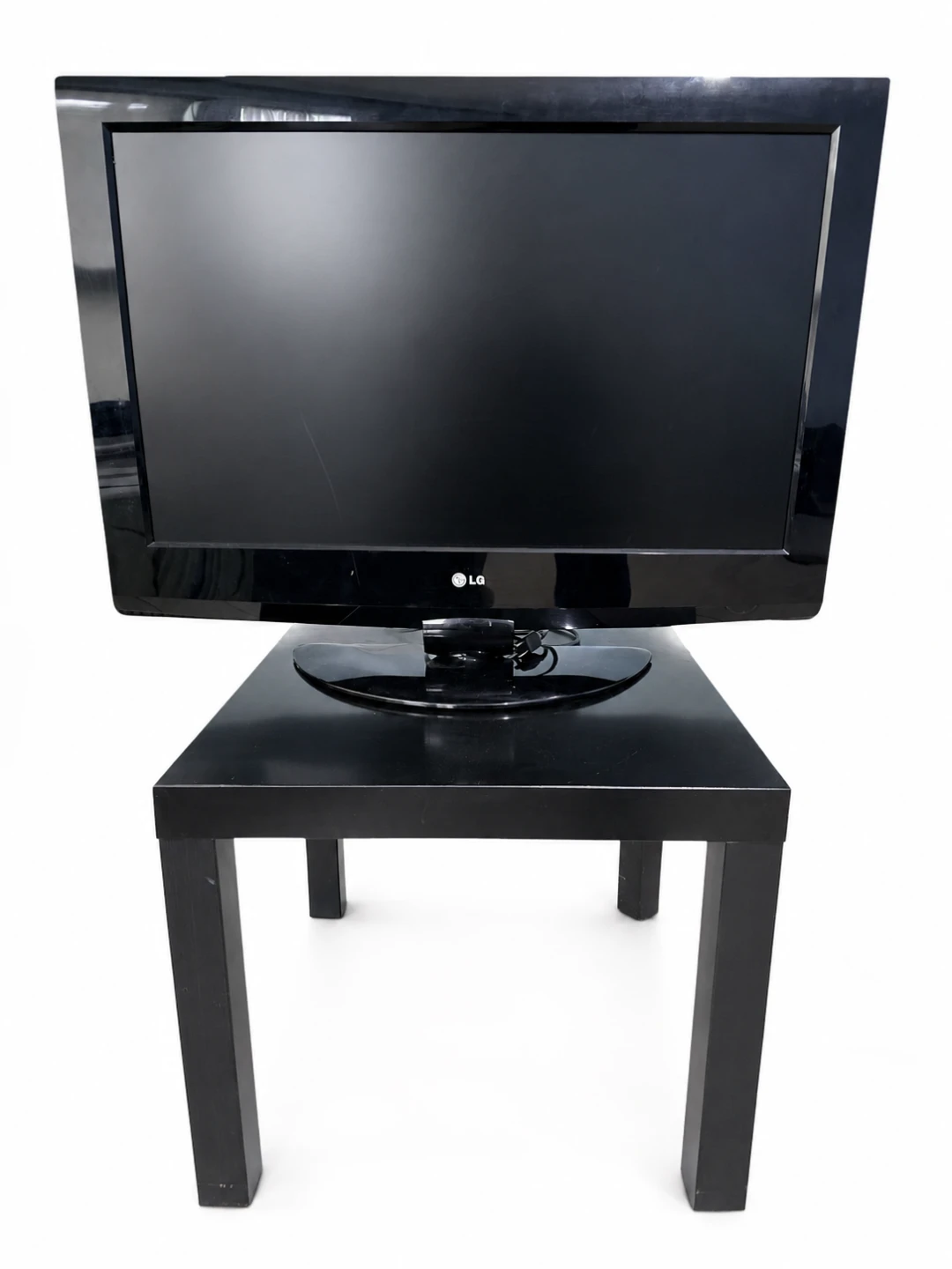 32-inch LG TV with a black IKEA LACK side table