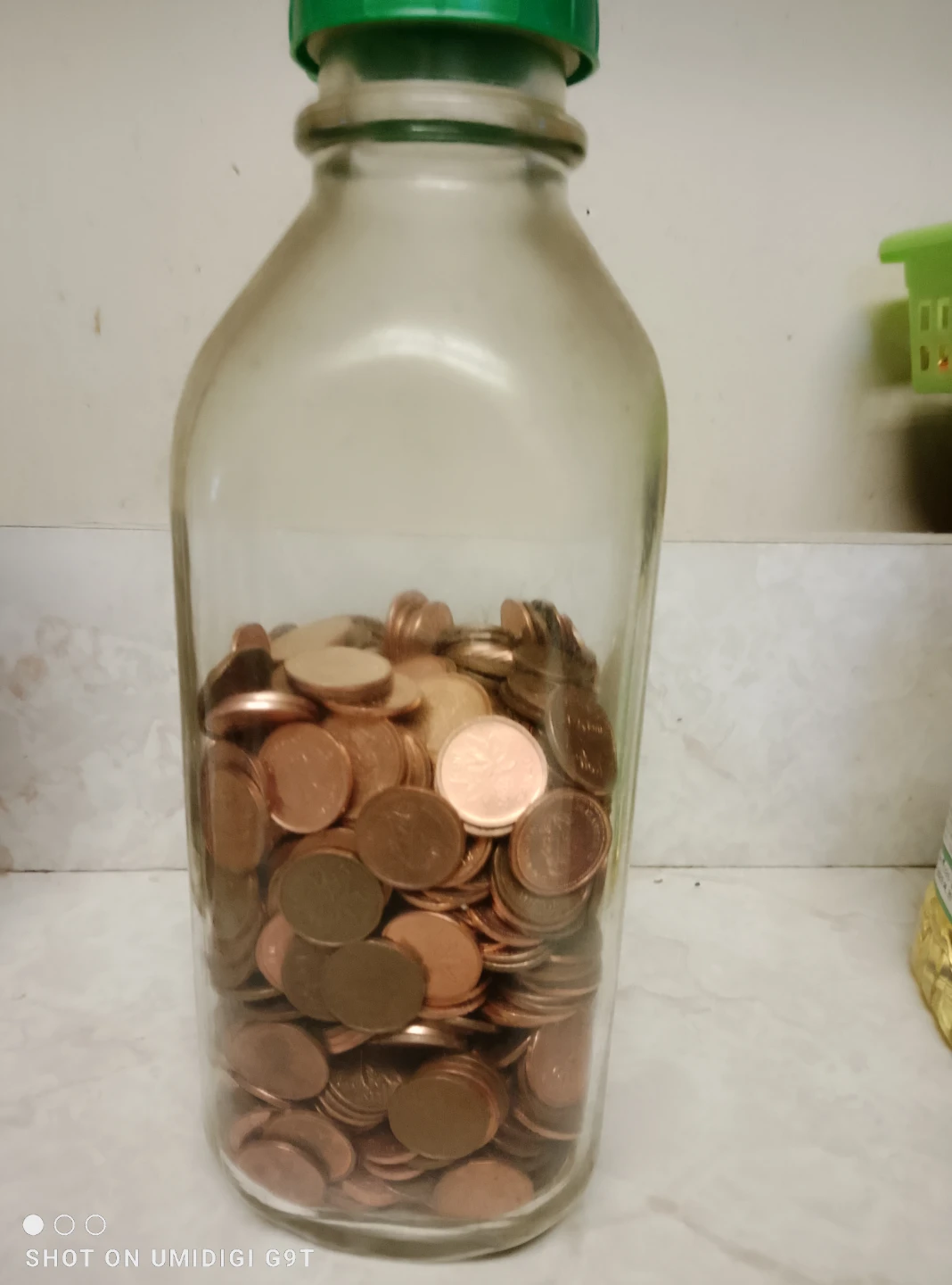 Glass Bottle Full of Pennies