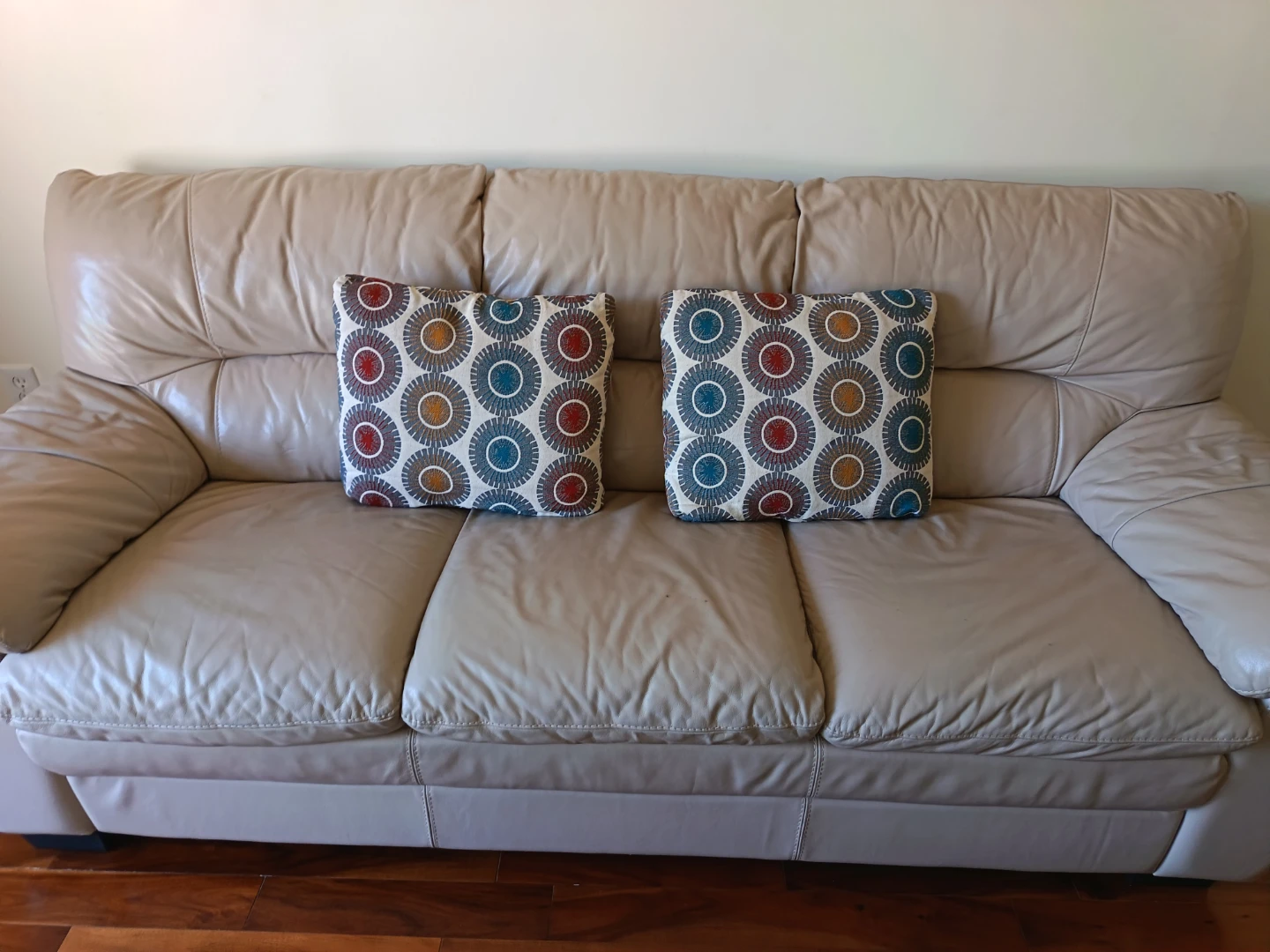 Cream Leather 3-Seater Sofa with Decorative Pillows