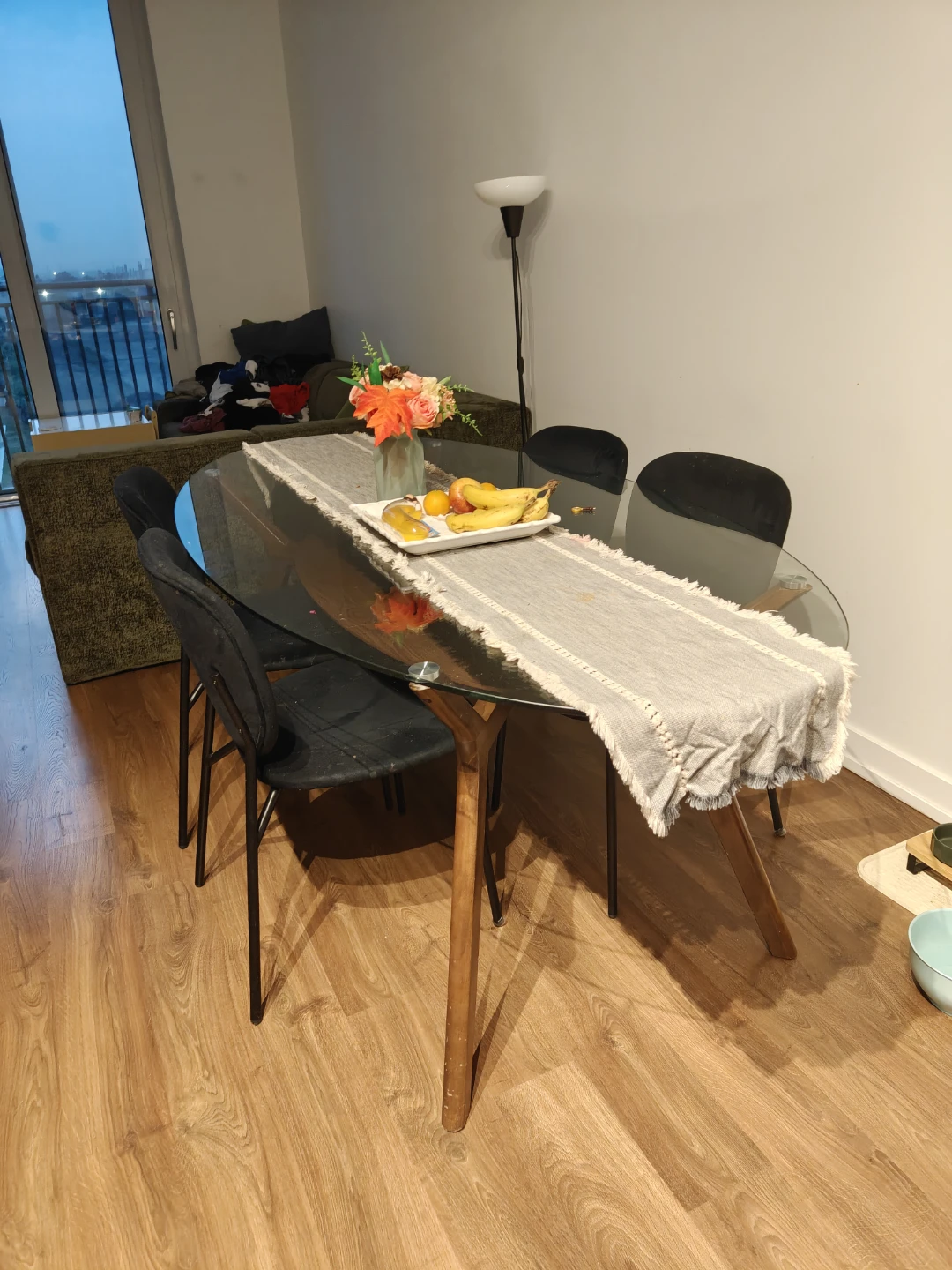 Oval Glass Dining Table with 4 Black Chairs